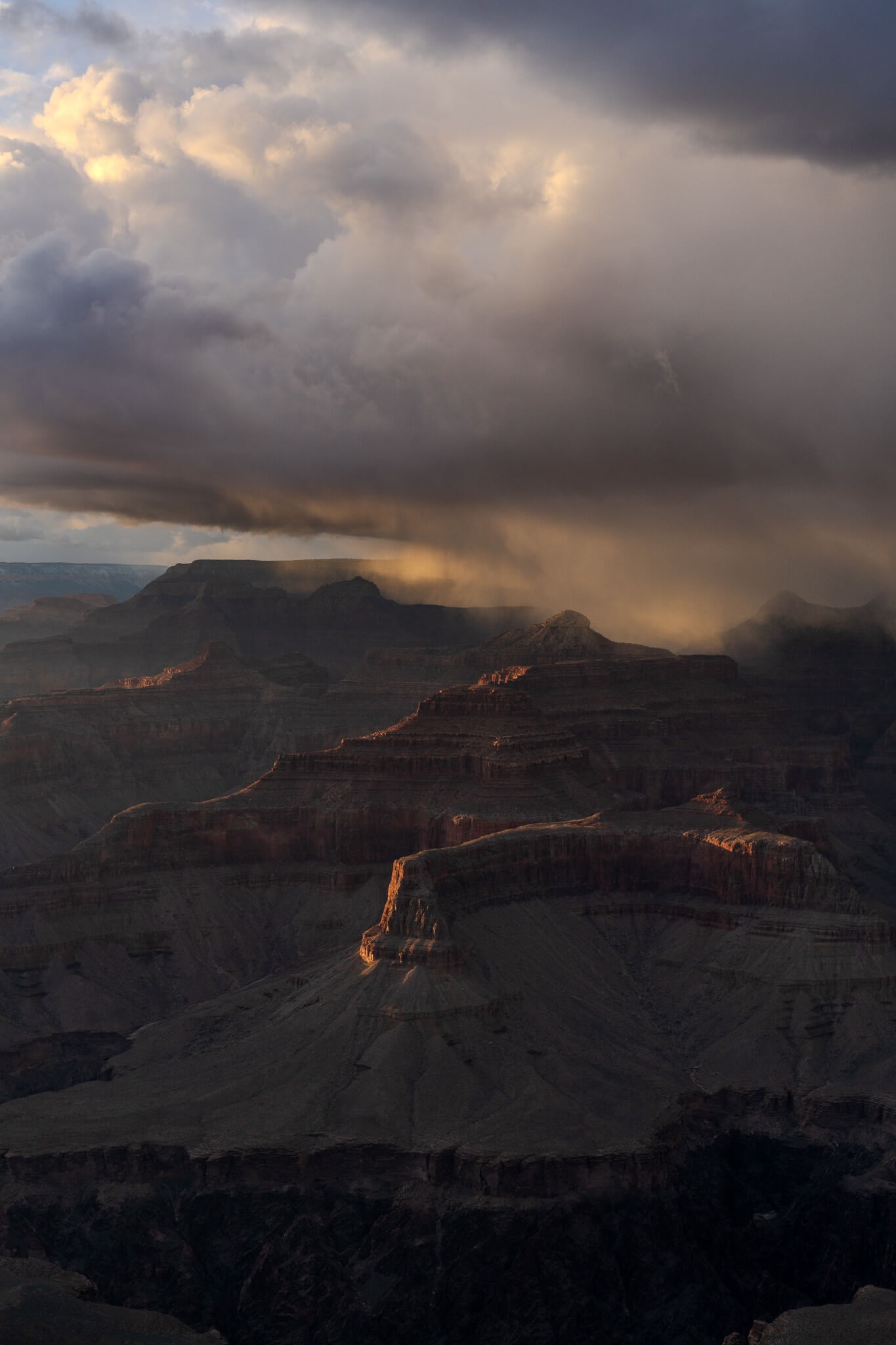 Storm light and rain clouds over the Grand Canyon photographed by Nick DiBari