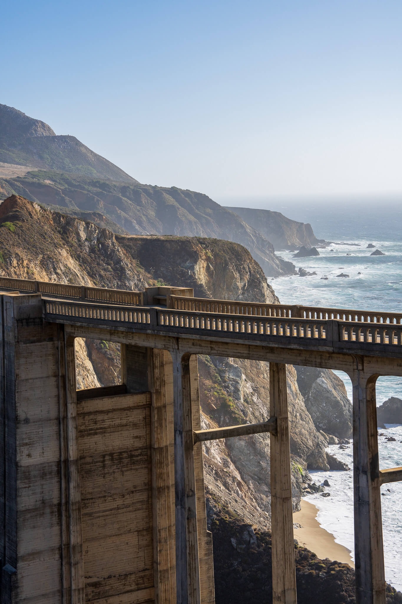 Coastal bridge and cliffs above the ocean photographed by Nick DiBari