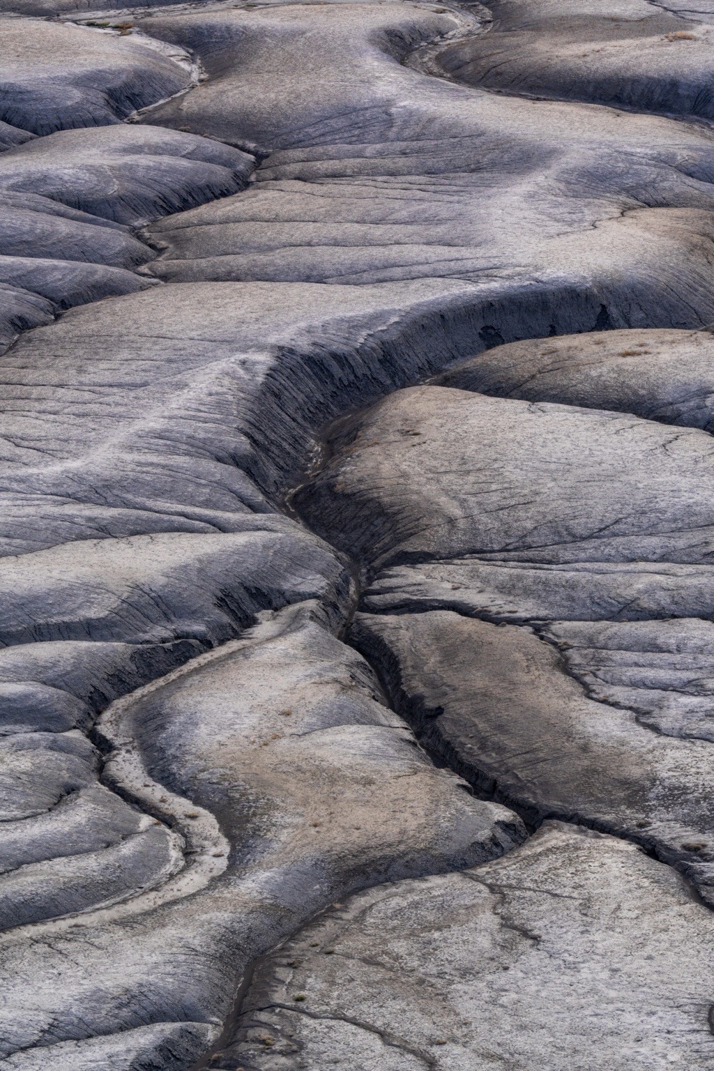 Abstract eroded desert terrain detail photographed by Nick DiBari